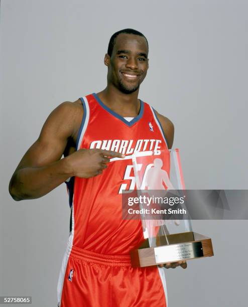 Emeka Okafor of the Charlotte Bobcats poses for a picture with the 2004-2005 Eddie Gottlieb Trophy in Charlotte, North Carolina on May 4, 2005. Emeka...