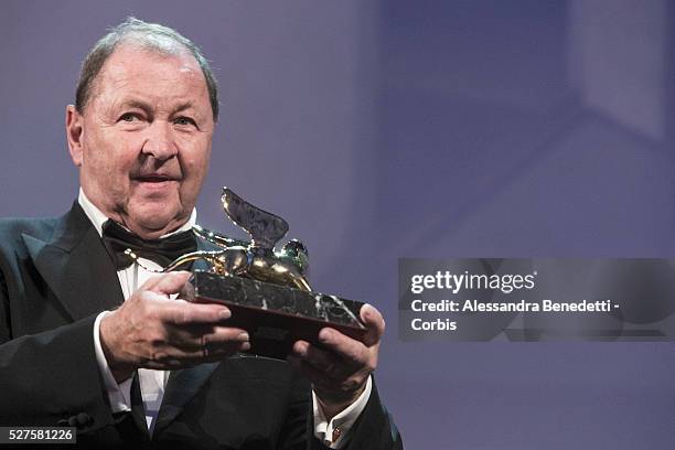 Roy Andersson receives the golden Lion for best movie A Pigeon Sat on a branch reflecting on existence.