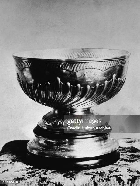 Photograph of the Stanley Cup, addressed to the Winnipeg Victorias, 1902. Shaped like a bowl mounted on a pedestal, the Cup was first presented in...