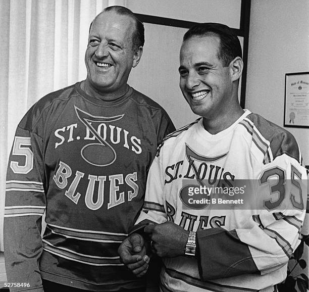 Canadian-born professional hockey player, coach, and general manager Lynn Patrick of the St. Louis Blues and the team owner Sid Salomon III model...