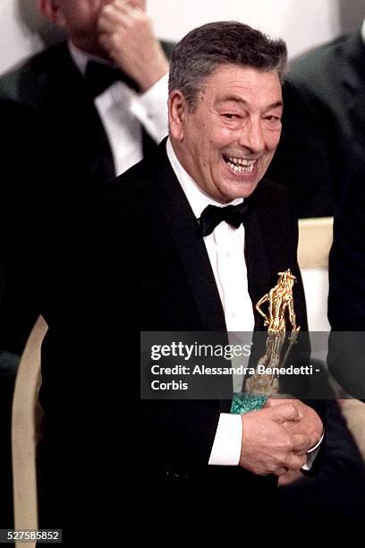 Italian director Gianni di Gregorio receives the Donatello awards for best inew director for his movie "Pranzo D'Agosto" during the 2009 ceremony of...