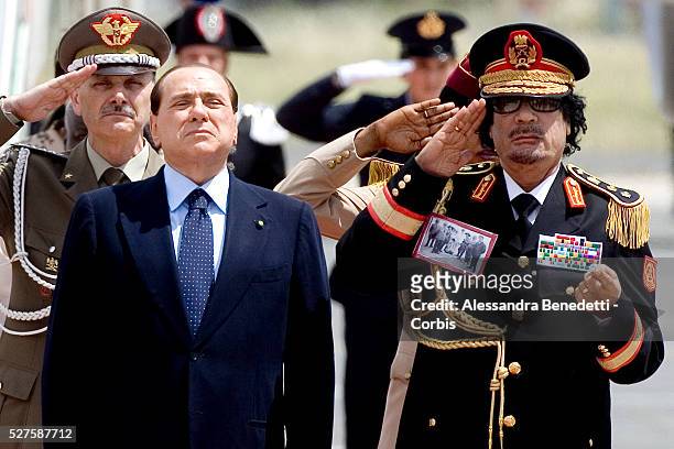 Italian Prime Minister Silvio Berlusconi welcomes Leader of Libia Muammar Al Gaddafi at Ciampino airport.Gaddafi is making his first visit to Libya's...