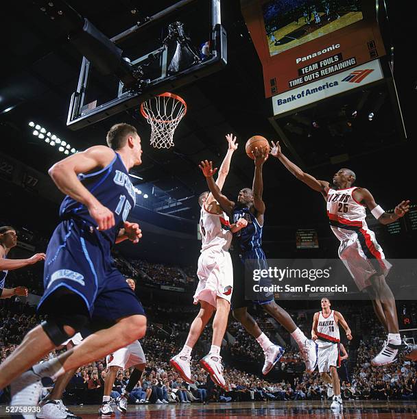 Kirk Snyder of the Utah Jazz drives to the basket against Viktor Khryapa of the Portland Trail Blazers during their NBA game at the Rose Garden on...