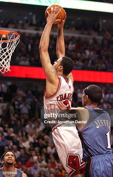 Tyson Chandler of the Chicago Bulls is fouled while dunking by Jared Jefferies of the Washington Wizards in Game five of the Eastern Conference...