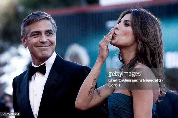 Us actor George Clooney and italian girlfriend actress and TV presenter Elisabetta Canalis arrive at the Venice Lido cinema Palace for the premiere...