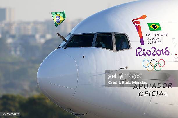 The official plane arriving with the Olympic flame from Geneva, on May 3, 2016 in Brasilia, Brazil. The Olympic torch will pass through 329 cities...