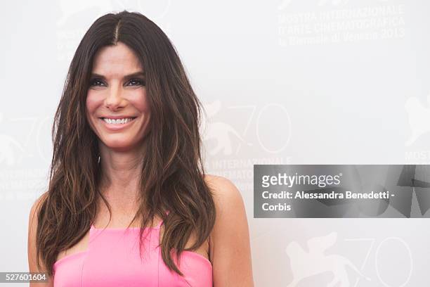 Sandra Bullock George Clooney and Alfonso Juaron attend the photocall of movie Gravity presented out of competition at the 70th International Venice...