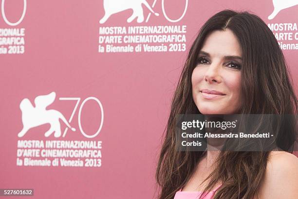 Sandra Bullock George Clooney and Alfonso Juaron attend the photocall of movie Gravity presented out of competition at the 70th International Venice...