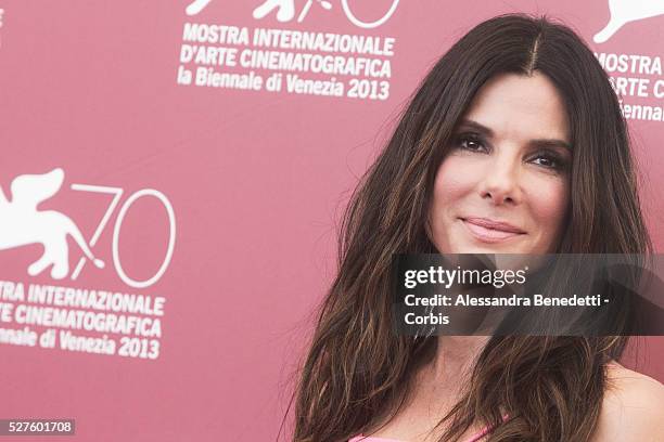 Sandra Bullock George Clooney and Alfonso Juaron attend the photocall of movie Gravity presented out of competition at the 70th International Venice...