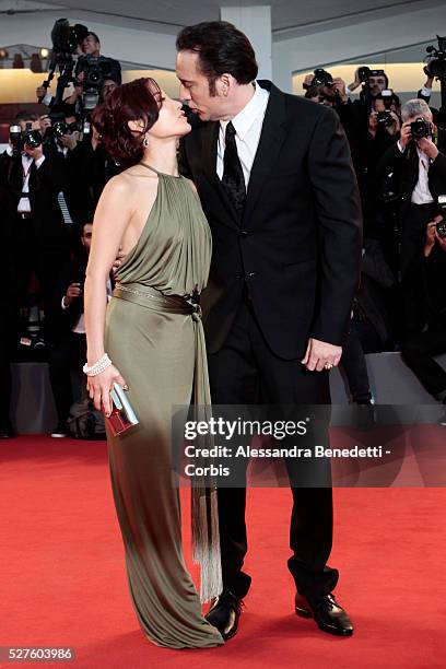 Nicolas Cage and wife Alice Kim kiss each other during the premiere of movie Joe, presnted in competition during the 70th International Venice film...