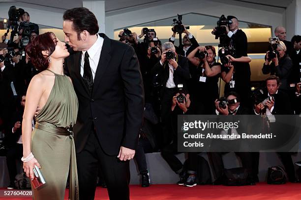 Nicolas Cage and wife Alice Kim kiss each other during the premiere of movie Joe, presnted in competition during the 70th International Venice film...