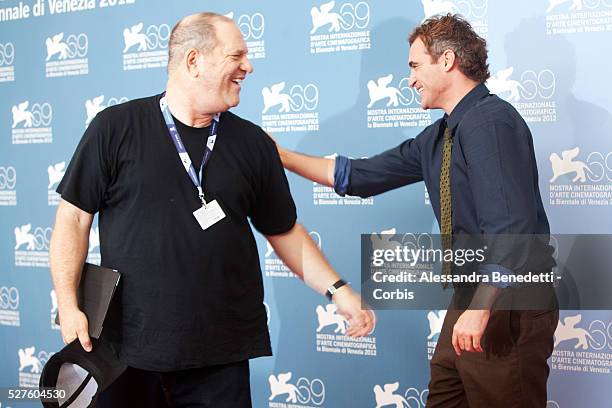 Harvey Weinstein and Joaquin Phoenix attend the photocall of movie The Master presented in competition at the 69th Venice Film Festival.