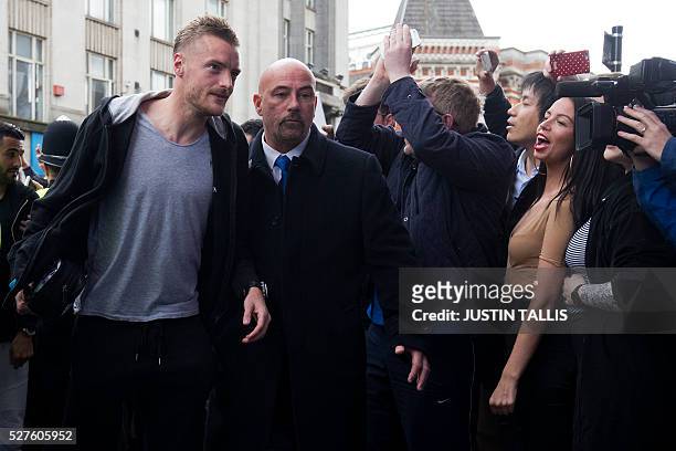 Leicester City's football player Jamie Vardy is cheered by crowds of waiting fans as he arrives for lunch at an Italian restaurant in the centre of...