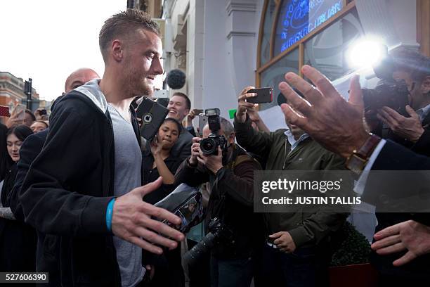 Leicester City's football player Jamie Vardy is cheered by crowds of waiting fans as he arrives for lunch at an Italian restaurant in the centre of...