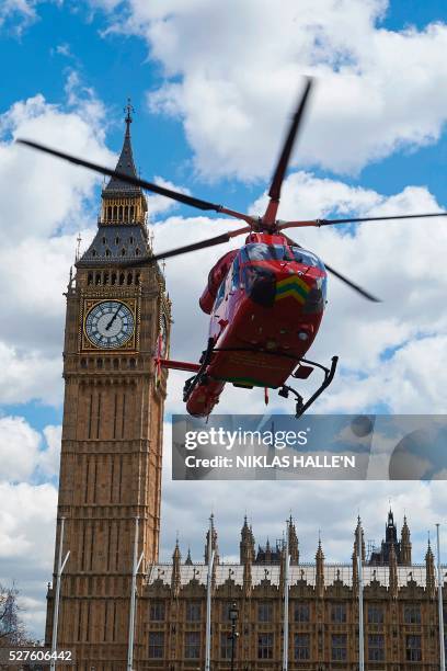 London air ambulance takes off from Parliament Square in front of the Houses of Parliament after it arrived earlier as part of the response to an...