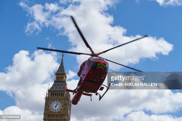 London air ambulance takes off from Parliament Square in front of the Houses of Parliament after it arrived earlier as part of the response to an...