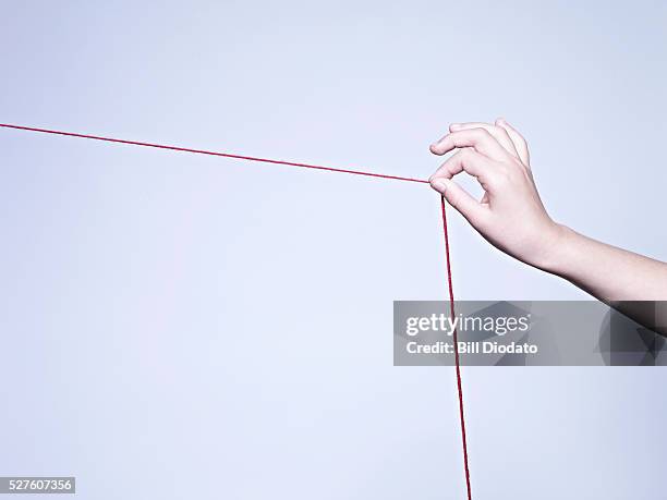 Hand String Photos and Premium High Res Pictures - Getty Images