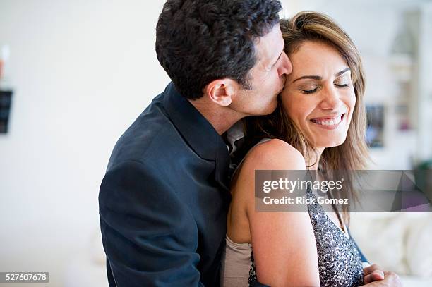 man kissing woman - couple kissing stock pictures, royalty-free photos & images