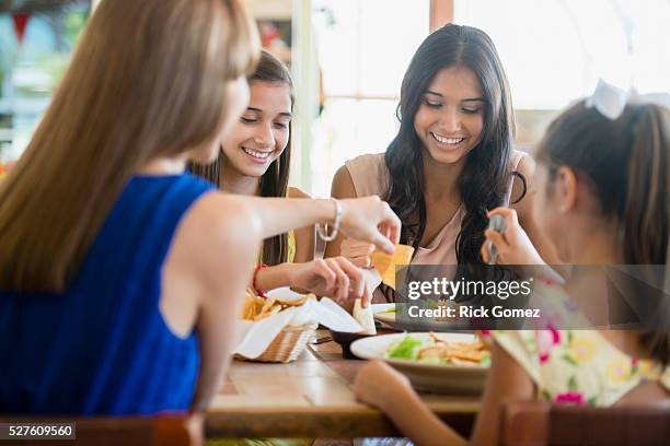 portrait of mexican sisters (10-12, 16-17) in restaurant, wellington, palm beach county, florida, usa - teen sibling stock pictures, royalty-free photos & images