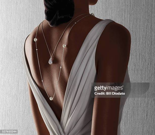woman wearing necklace - jewelry stock pictures, royalty-free photos & images