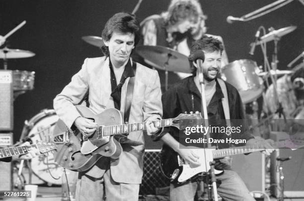 George Harrison and Eric Clapton at Limehouse Studios in London during recording of the TV programme 'Blue Suede Shoes', spotlighting veteran...