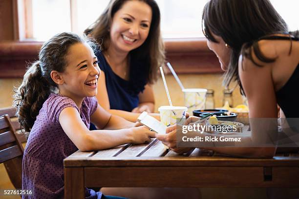 latinas at lunch - children restaurant stock pictures, royalty-free photos & images