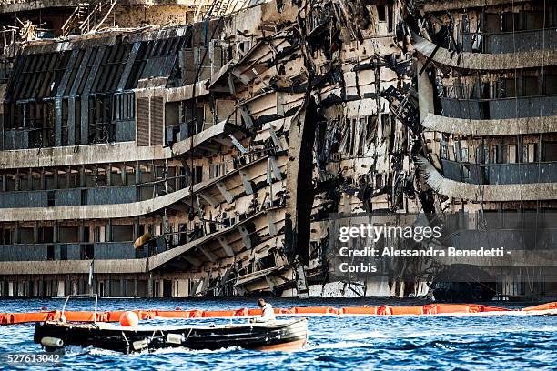 The Damaged Costa Concordia cruiseship is patroled by Italian Police and Technicinas the morning after the purbuckling operation successfully...