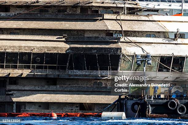 The Damaged Costa Concordia cruiseship is patroled by Italian Police and Technicinas the morning after the purbuckling operation successfully...