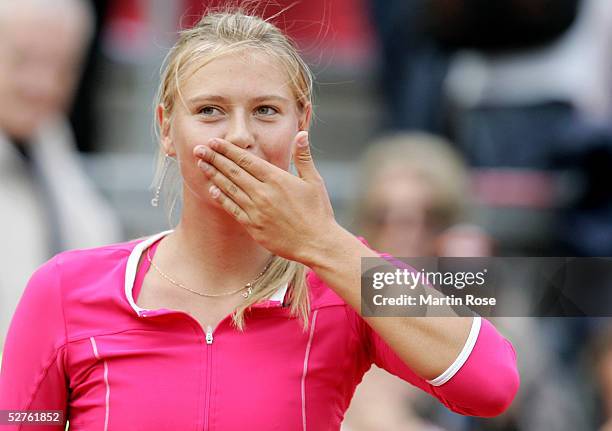 Maria Sharapova of Russia celebrates winning against Shuai Peng of China during the Qatar Total German Open on May 5, 2005 in Berlin, Germany.