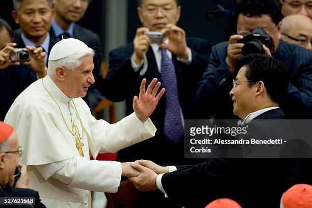His holiness Pope Benedict XVI greets chinese Doublebass player Dongjian Gong at the end of a special concert performed by the China Philharmonic...