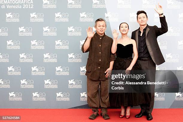 Kim Ki-duk, Cho Min-soo and Lee Jung-jin attend the photocall of movie Pieta, presented in competition at the 69th Venice Film Festival