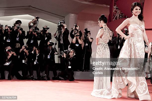 Selena Gomez and Vanessa Hudgens attend the photocall of movie Spring Breakers presented in competition at the 69th Venice Film Festival.