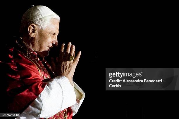 Pope Benedict XVI greets pilgrims from the terrace above the Basilica of our Lady of the Rosary at the end of Marian procession.