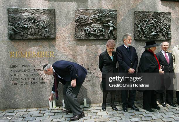 Ken Jacobson , associate national director of the Anti-Defamation League, lights a candle at the Wall of Remembrance in Dag Hammarskjold Plaza near...