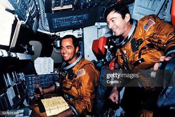 Astronauts Robert Crippen and John Young are seen in the flight deck of Columbia of the space shuttle Columbia before the first shuttle flight at...