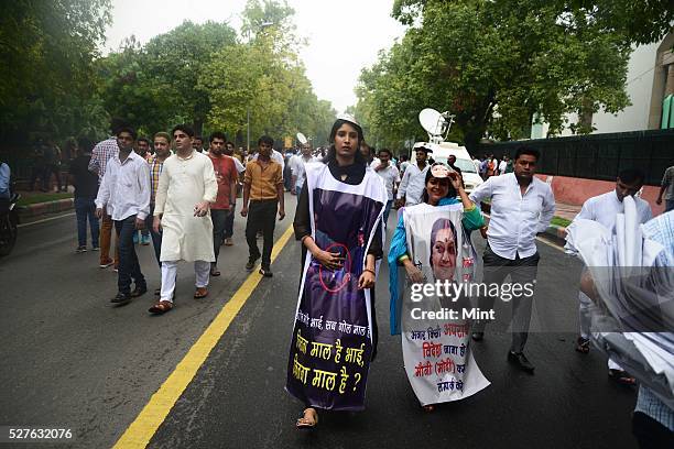 Indian Youth Congress workers stage a street play against various scams of the NDA government at Raisina Road on August 6, 2015 in New Delhi, India.