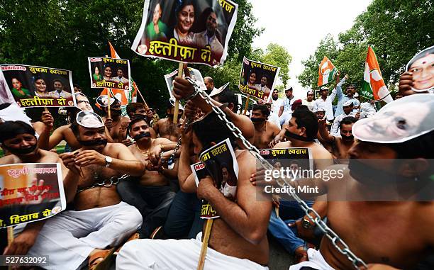 Indian Youth Congress workers in a shirtless protest against various scams of the NDA government at Raisina Road on August 6, 2015 in New Delhi,...