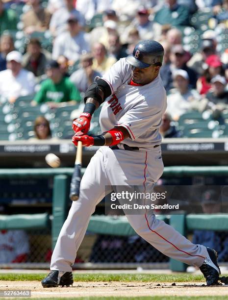 David Ortiz of the Boston Red Sox swings at a pitch for a single against the Detroit Tigers during the game at Comerica Park May 5, 2005 in Detroit,...