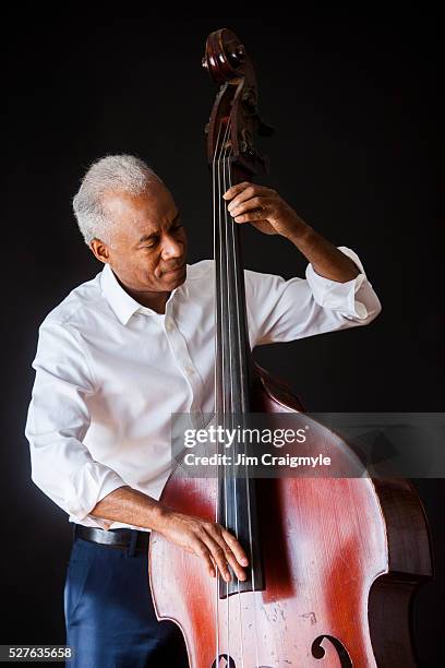 african american man 60's playing a double bass - double bass stock pictures, royalty-free photos & images