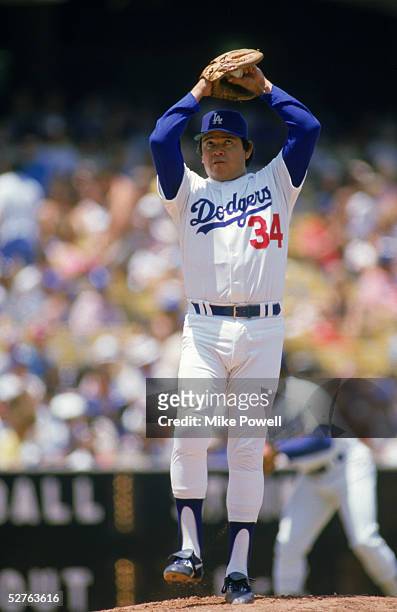 June,1986: Pitcher Fernando Valenzuela of the Los Angeles Dodgers winds up for a pitch during a June, 1986 MLB season game against the Houston Astros...