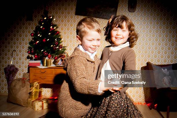 boy and girl (4-7) dancing during christmas - archive danse stock pictures, royalty-free photos & images