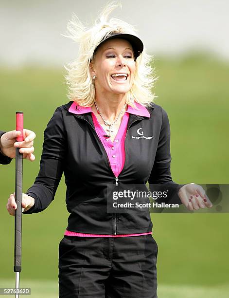 Danielle Amiee, winner of the Golf Channel's "Big Break III", laughs as she walks off the tenth green during the first round of the Michelob Ultra...