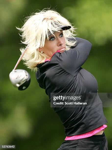 Danielle Amiee, winner of the Golf Channel's "Big Break III", watches her tee shot on the ninth hole during the first round of the Michelob Ultra...