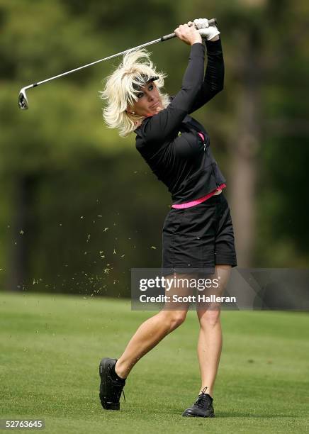 Danielle Amiee, winner of the Golf Channel's "Big Break III", watches her approach shot on the ninth hole during the first round of the Michelob...