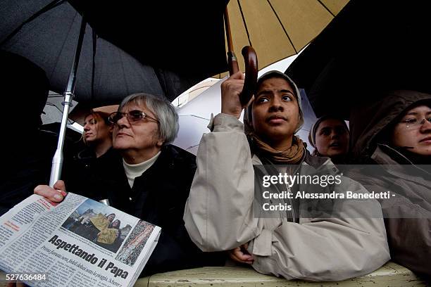 Faithfuls awaits in St. Peter's Square for the election of the new Pope successor of Pope Benedict XVI during the second day of the conclave.