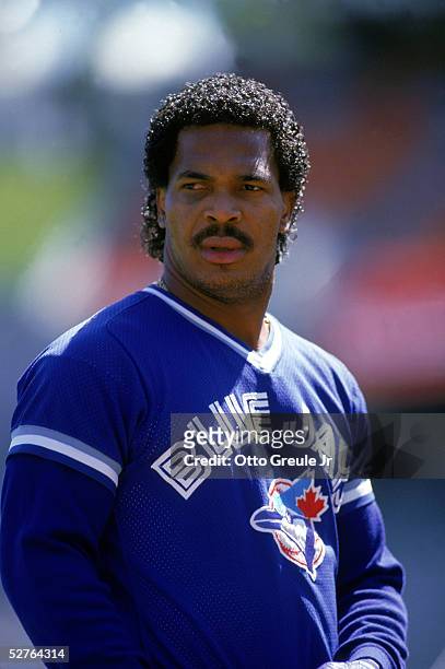 George Bell of the Toronto Blue Jays rests during a 1987 game against the Oakland Athletics at the Oakland-Alameda Coliseum in Oakland, California.