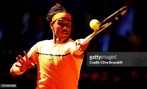 Rafael Nadal of Spain plays a forehand against Andrey Kuznetsov of Russia in their second round match during day four of the Mutua Madrid Open tennis...