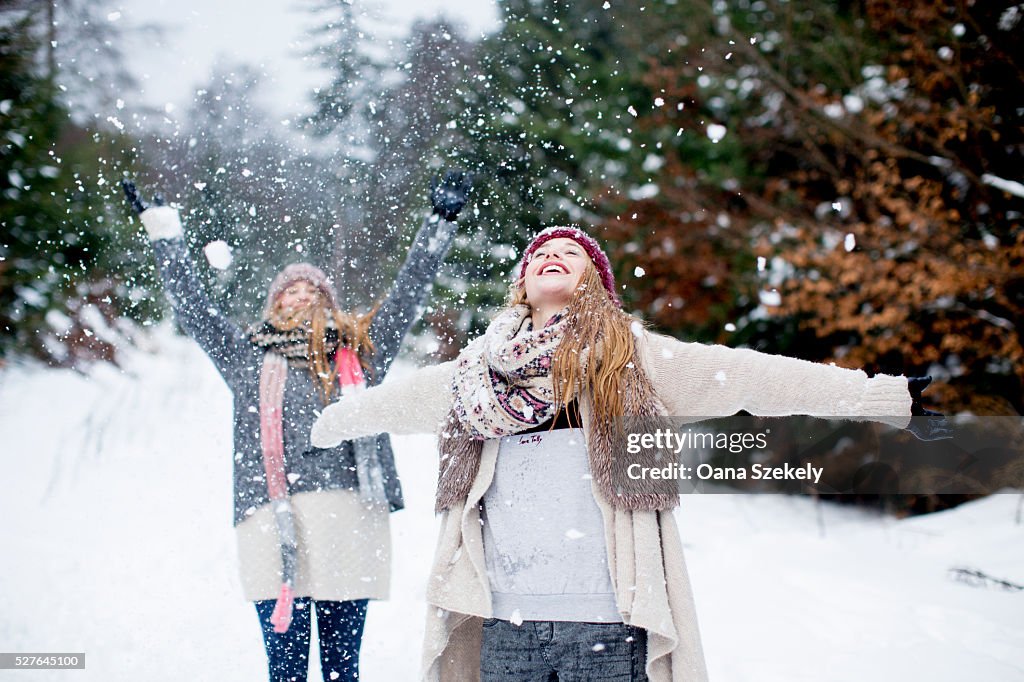 Sisters having fun in snow