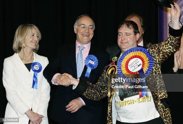 Conservative Leader Michael Howard alongside his wife Sandra Howard shakes hands with Lord Toby Jug of The Official Monster Raving Loony Party at the...