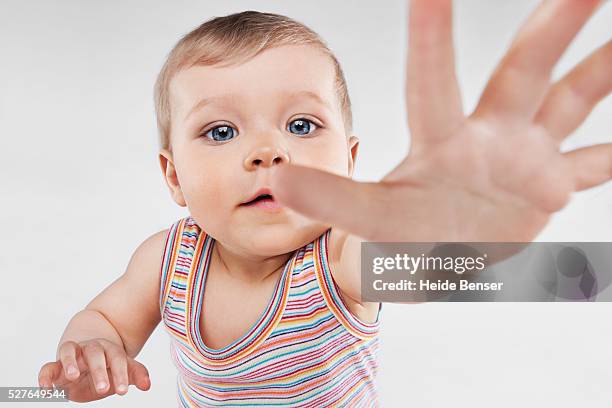 baby reaching - baby reaching stock pictures, royalty-free photos & images